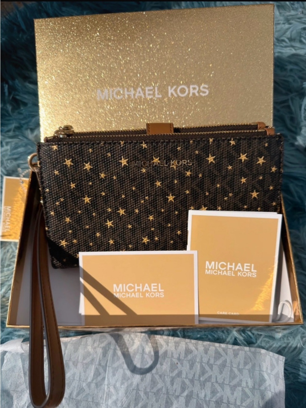 Michael Kors Black Wristlet with Gold Star Accents